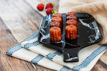 Canele is a small French pastry with rum and vanilla