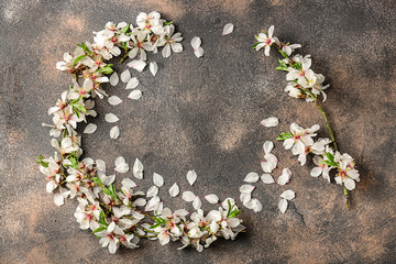 Composition with beautiful blossoming branches on grunge background