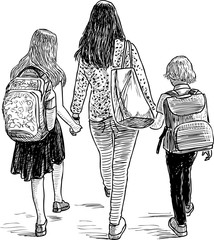 A mother with her kids going to school