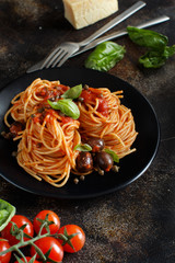Spaghetti with tomato sauce olives and capers