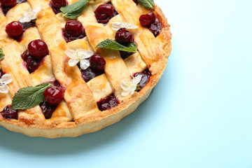 Tasty cherry pie on color background, closeup