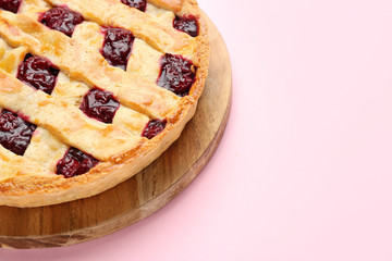 Tasty cherry pie on color background, closeup