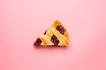 Piece of tasty cherry pie on color background © Pixel-Shot