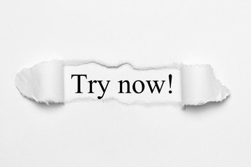Try now! on white torn paper