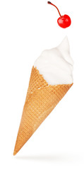 red cherry falling on a soft serve ice cream cone isolated