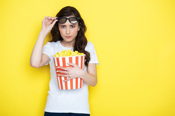 Waist up of angry brunette lady putting off 3d glasses