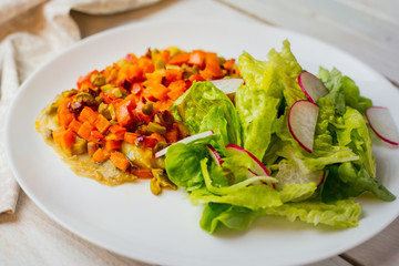 Baked vegetables with sauce and salad.  Radish. Diet. Vegetarian. Homemade.