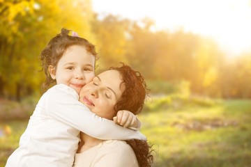 Happy Mother and daughter hugging, happy family, mothers day.