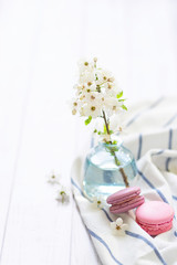 coffee and macaron in white wood background spring breakfast