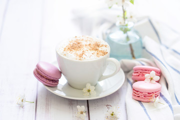 coffee and macaron in white wood background spring breakfast