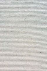 Dense gray fabric for upholstery. Blank background for layout with vignette. Fabric texture with embossed close-up.