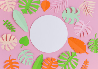 White circle on a pink background with colored leaves