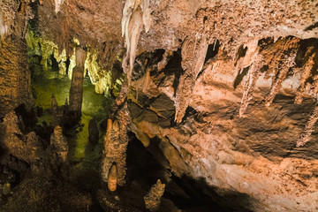 The beautiful stalactites and stalagmites and other rock formations are reflected in a small lake in the Antro del Monte Corchia cave in the Apuan Alps in Italy.