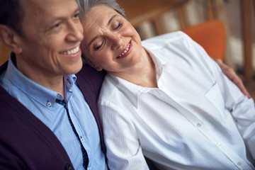 Happy beloved aged couple enjoying to be together