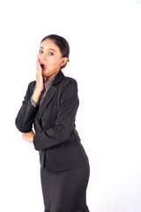 Portrait isolated Southeast Asian business woman wears dark gray suit action like got surprise news with white background and show feeling happy and amazed
