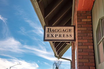 Painted sign that reads Baggage Express