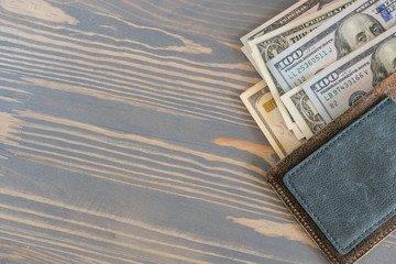 A wallet with few money on a workplace