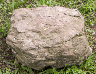 big stone on grass background