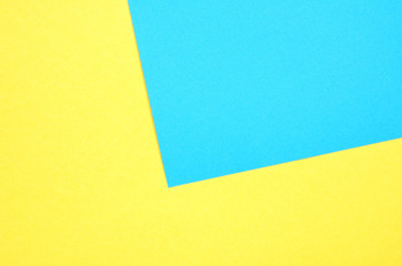 Geometric paper background. Yellow and turquoise color paper texture background.- Image