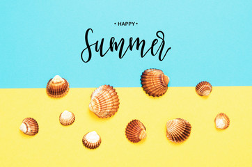 Inscription Happy Summer. Sea shells pattern on  turquoise and yellow paper background. Summer concept. Flat lay, top view - Image