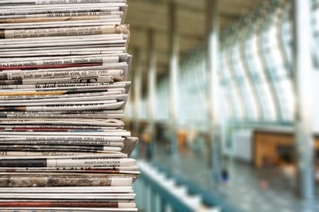 Pile of newspapers on background