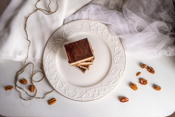 tasty chocolate authentic canadian dessert Nanaimo with nuts in healthy version - plant based and shugar free