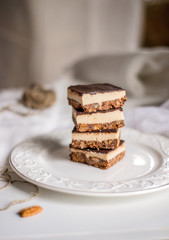 tasty chocolate authentic canadian dessert Nanaimo with nuts in healthy version - plant based and shugar free
