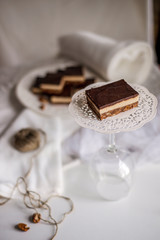 tasty chocolate authentic canadian dessert Nanaimo with nuts in healthy version - plant based and shugar free