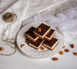 tasty chocolate authentic canadian dessert Nanaimo with nuts in healthy version - plant based and shugar free