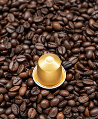 Golden coffee capsule.