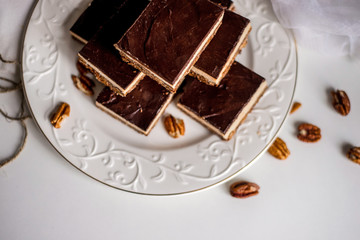 tasty chocolate authentic canadian dessert Nanaimo with nuts in healthy version - plant based and shugar free