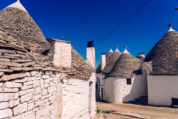 Beautiful single-storey houses of rounded construction called trulli, typical of the area of Alberobello in Italy.