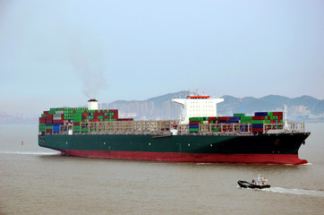 Container ship departing from port.