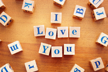 I love you. Conceptual image with the text made from wooden cubes on a desk