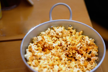 popcorn in aluminium bow on the table