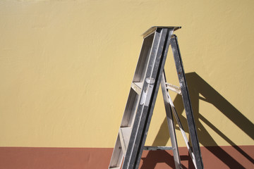 Abstract of Aluminum ladder with two tone Cream and brown texture background