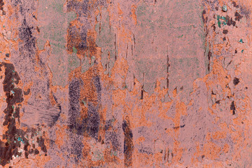 Old cracked rusty damaged painted metal background texture close-up