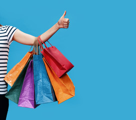 Happy young woman with shopping bags