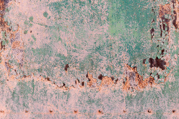 Old cracked rusty damaged painted metal background texture close-up