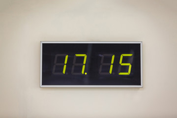 Black digital clock on a white background showing time 17.15 minutes