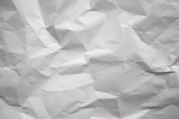 Fototapeta premium Crumpled white paper background texture