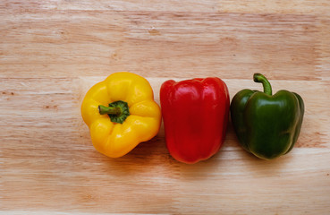 à¸´Bell peppers colorful on wood table