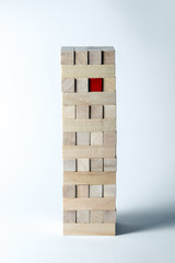 The tower of wooden cubes, as a symbol of support, teamwork and business development. Vertical frame