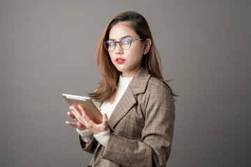 Portrait of Attractive business woman in studio grey background