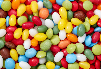 Fototapeta na wymiar Colored candy pills background