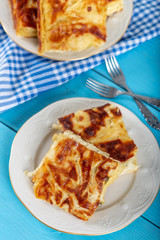 Su Boregi / Turkish Patty on wooden background.