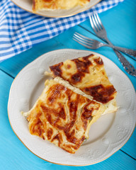 Su Boregi / Turkish Patty on wooden background.