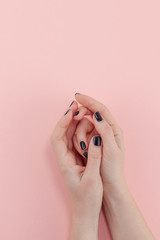 Woman's hands with black manicure