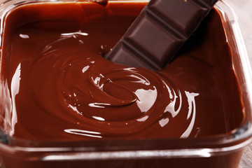 Melting chocolate, melted delicious chocolate for handmade praline icing confectionery