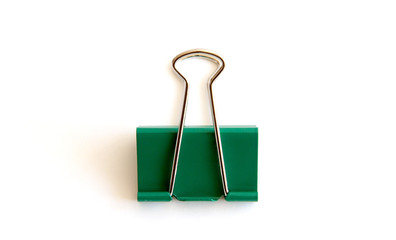 Green paper clip isolated on white background - image